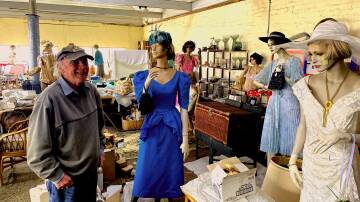 Chris Page, owner of the Walcha Junque, with some antique mannequins . Picture Heath Forsyth 